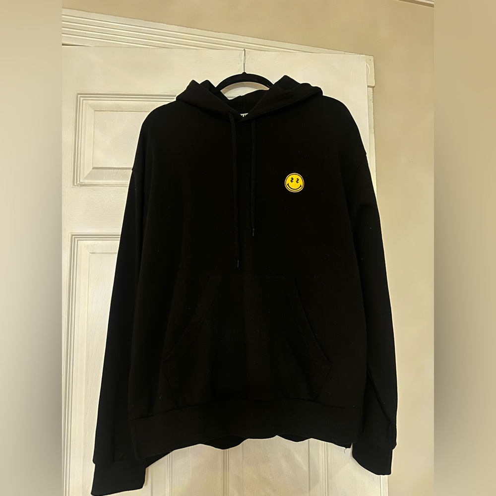 A land black smiley face hoodie